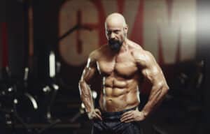 shot of a serious mature male bodybuilder posing shirtless at the gym looking to the camera handsome mature athlete posing shirtless showing off his muscular perfect torso stockpack istock